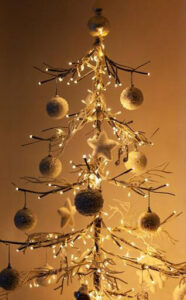 Scandinavia favors minimalist wooden trees paired with natural forage decorations like pinecones and berries