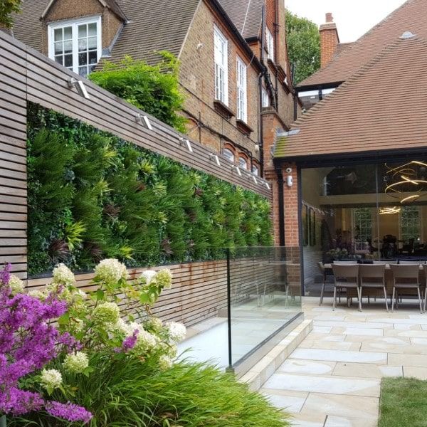 About Us fake plants in yard